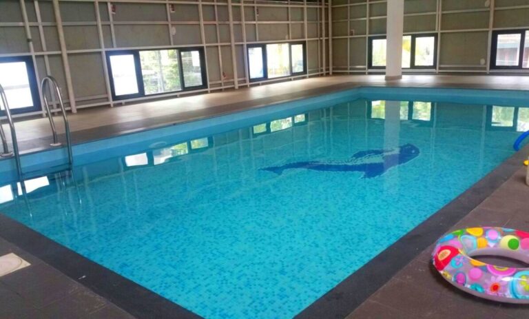 school with swimming pool near me